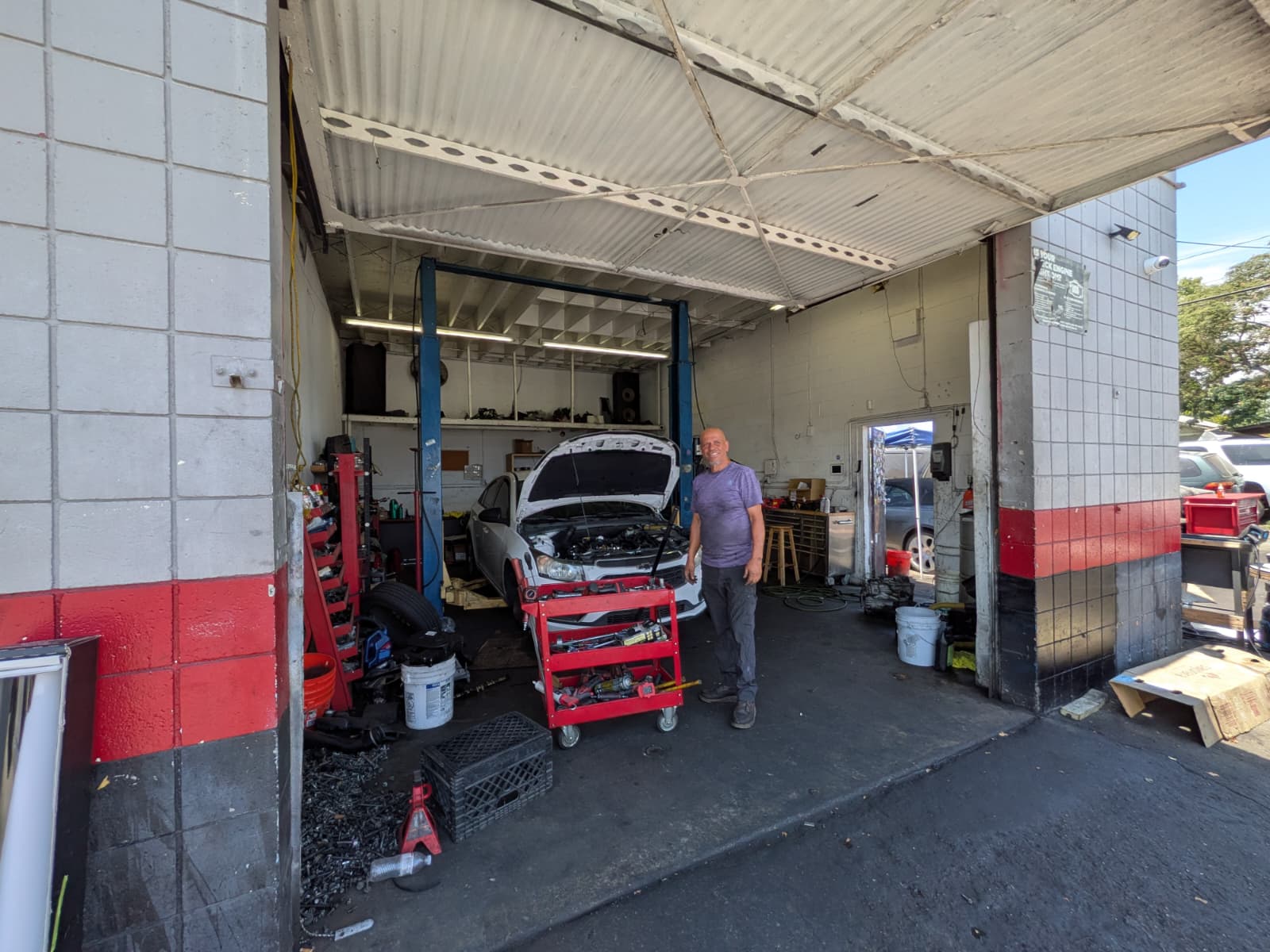 Engine Bros Auto Repair service bay with a vehicle being serviced